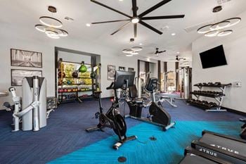 24-Hour fitness center with cardio and weight training equipment